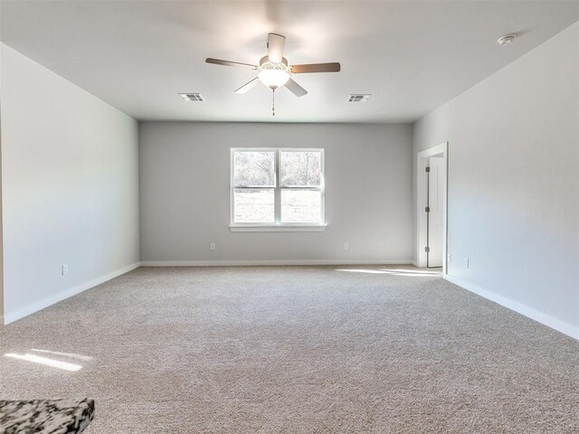 813 Stella Trl, Guthrie, OK 73044 - empty room featuring a ceiling fan, carpet flooring, a smoke detector, and baseboards