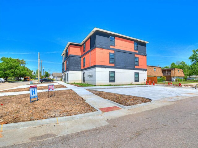 103 E Edwards St, Edmond, OK 73034 - view of building exterior with uncovered parking
