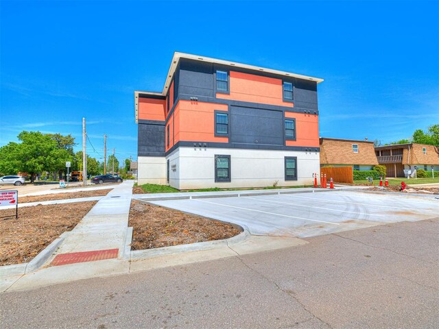 103 E Edwards St, Edmond, OK 73034 - view of building exterior featuring uncovered parking
