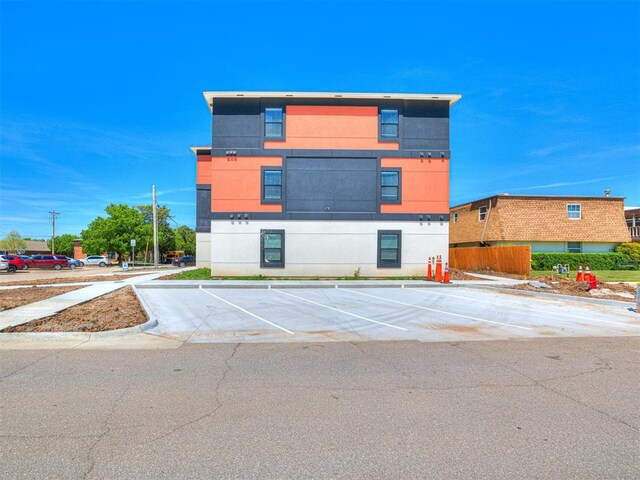 103 E Edwards St, Edmond, OK 73034 - view of property featuring uncovered parking