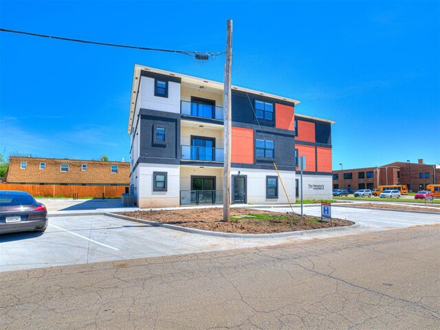 103 E Edwards St, Edmond, OK 73034 - view of property featuring uncovered parking