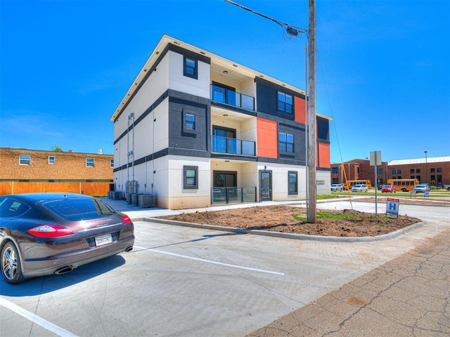 103 E Edwards St, Edmond, OK 73034 - view of property featuring uncovered parking