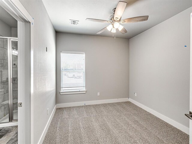 103 E Edwards St, Edmond, OK 73034 - unfurnished room featuring a ceiling fan, carpet flooring, and baseboards