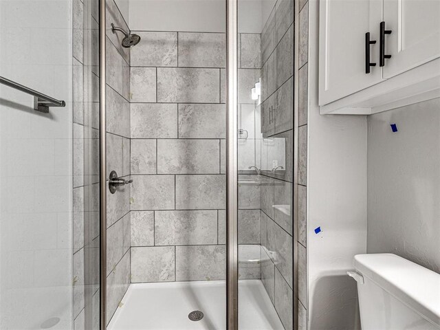 103 E Edwards St, Edmond, OK 73034 - bathroom featuring a stall shower and toilet