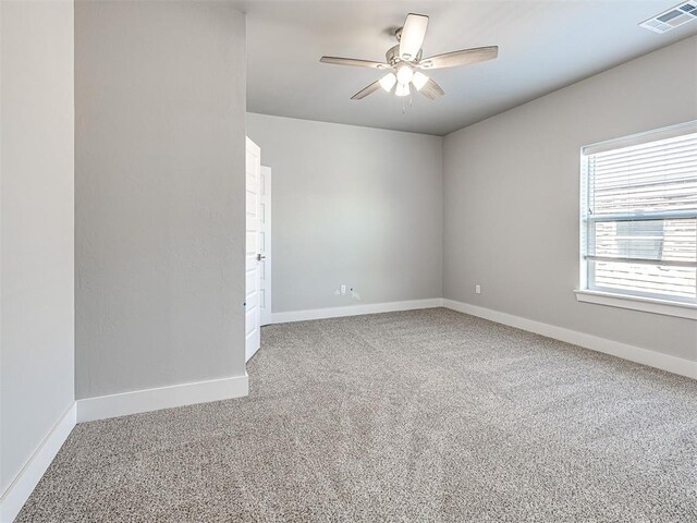 103 E Edwards St, Edmond, OK 73034 - unfurnished room featuring carpet, ceiling fan, and baseboards