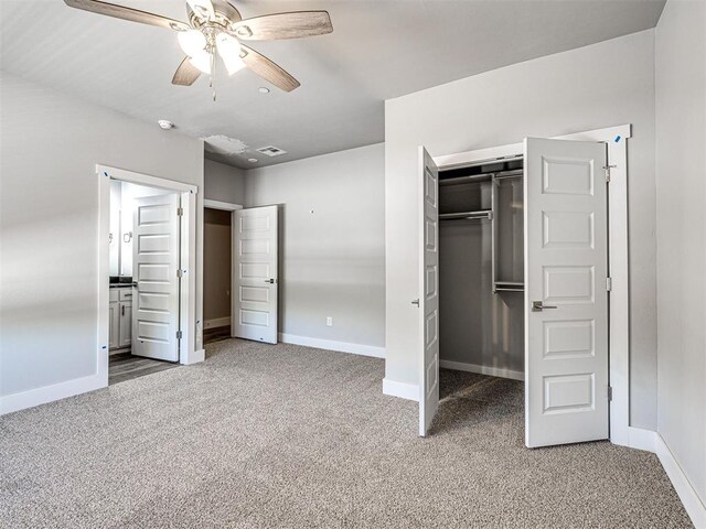 103 E Edwards St, Edmond, OK 73034 - unfurnished bedroom featuring carpet floors, baseboards, a closet, and a ceiling fan
