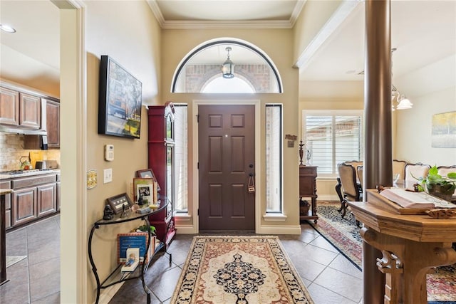 3201 Pinehurst Dr, Norman, OK 73072 - tiled foyer entrance with crown molding and baseboards