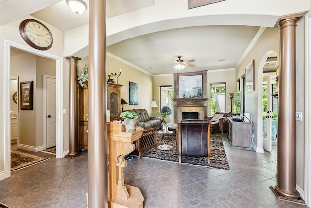 3201 Pinehurst Dr, Norman, OK 73072 - living room featuring ornate columns, a ceiling fan, ornamental molding, a fireplace, and tile patterned floors