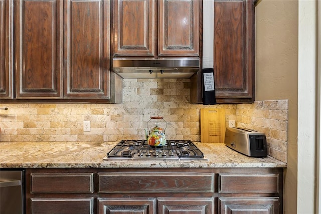 3201 Pinehurst Dr, Norman, OK 73072 - kitchen featuring stainless steel gas stovetop, dark brown cabinetry, tasteful backsplash, and light stone countertops