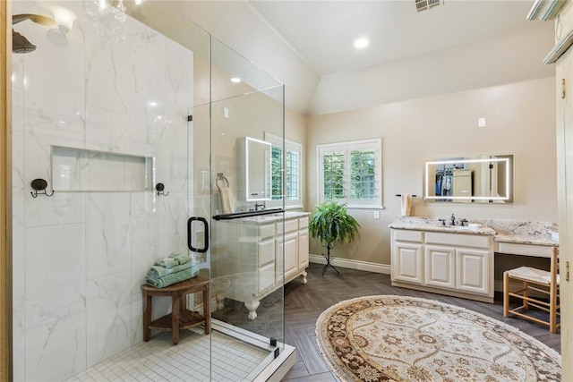3201 Pinehurst Dr, Norman, OK 73072 - bathroom featuring vanity, a marble finish shower, and vaulted ceiling