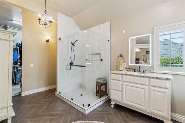 3201 Pinehurst Dr, Norman, OK 73072 - full bathroom featuring a marble finish shower, vanity, a chandelier, lofted ceiling, and a spacious closet