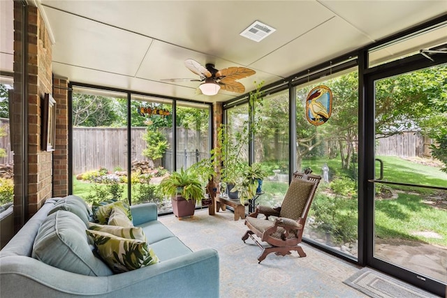 3201 Pinehurst Dr, Norman, OK 73072 - sunroom / solarium featuring expansive windows, plenty of natural light, a ceiling fan, and carpet