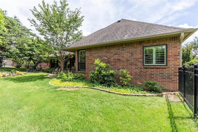 3201 Pinehurst Dr, Norman, OK 73072 - view of property exterior with a shingled roof and brick siding