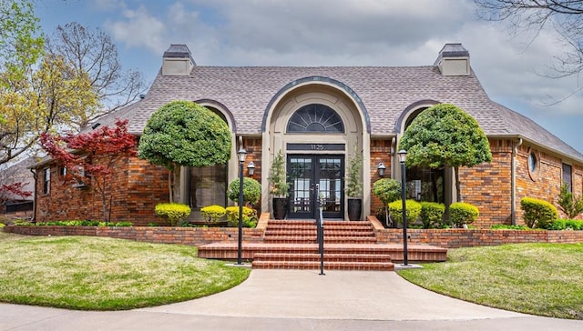 3201 Pinehurst Dr, Norman, OK 73072 - doorway to property with french doors, a chimney, and brick siding