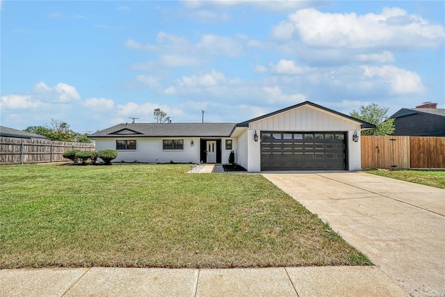 404 Comanche Trl, Altus, OK 73521 - view of front of property featuring a garage, driveway, and stucco siding