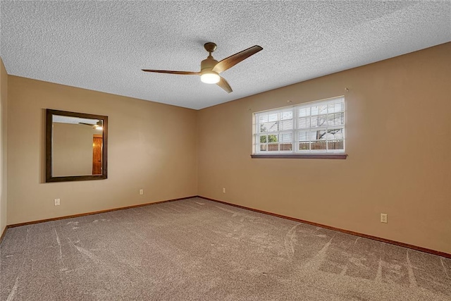 404 Comanche Trl, Altus, OK 73521 - carpeted spare room with ceiling fan, a textured ceiling, and baseboards