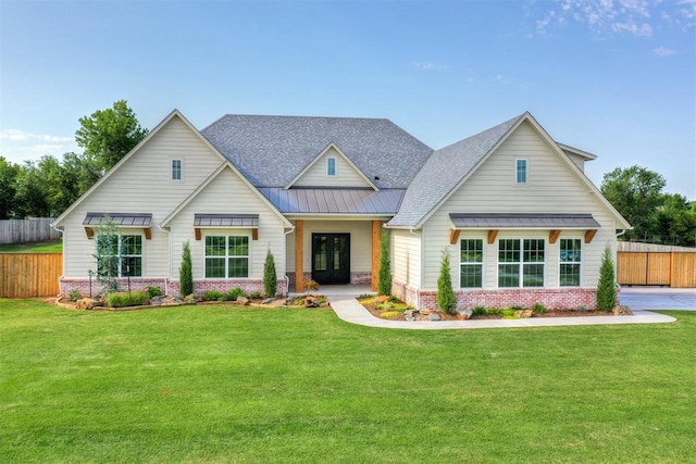 612 E Coffee Creek Rd, Edmond, OK 73034 - view of front of property featuring a standing seam roof, french doors, brick siding, metal roof, and a shingled roof