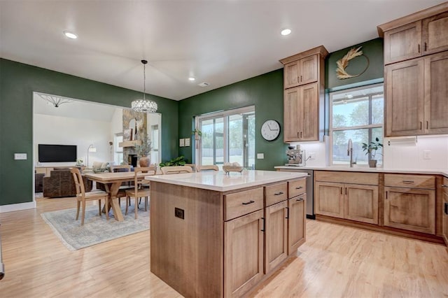 612 E Coffee Creek Rd, Edmond, OK 73034 - kitchen featuring light wood-type flooring, plenty of natural light, light countertops, a sink, and recessed lighting