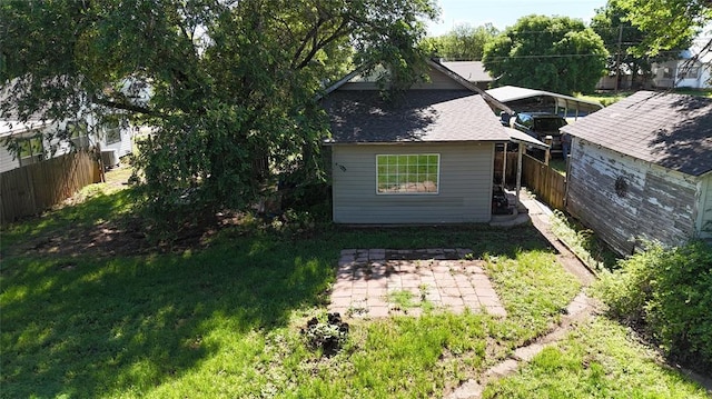 305 N Reimer St, Corn, OK 73024 - rear view of house featuring a patio area and a shingled roof
