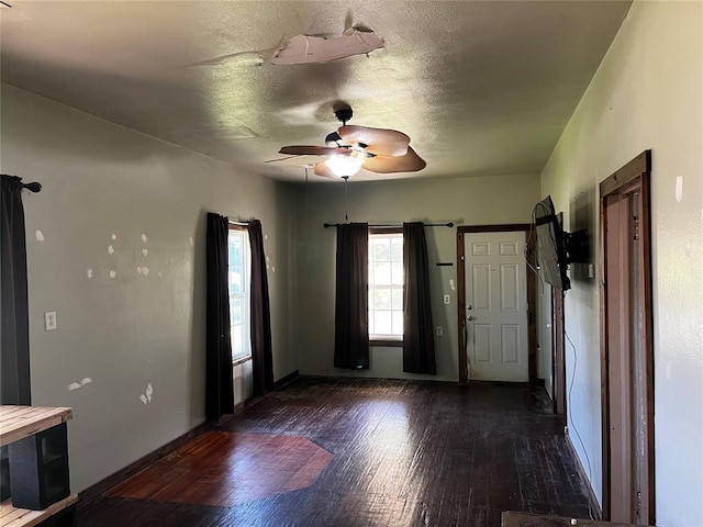 305 N Reimer St, Corn, OK 73024 - entryway with dark wood-type flooring, a ceiling fan, baseboards, and a textured ceiling