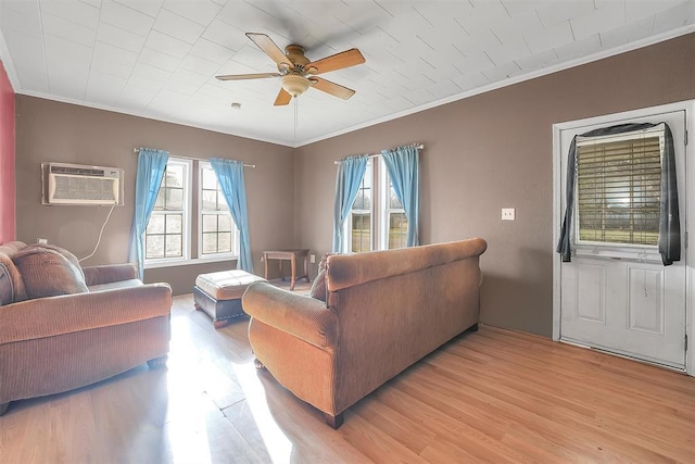 209 E 3rd St, Erick, OK 73645 - living area with a wall mounted AC, ornamental molding, a ceiling fan, and light wood-type flooring