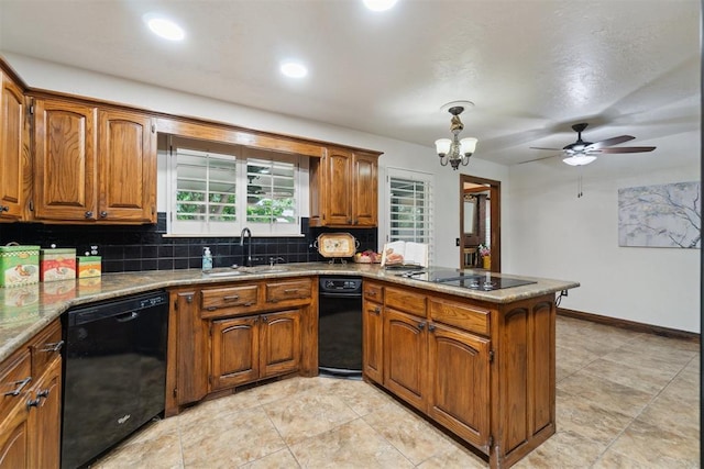 4113 Old Farm Rd, Oklahoma City, OK 73120 - kitchen with black appliances, a peninsula, brown cabinetry, tasteful backsplash, and recessed lighting