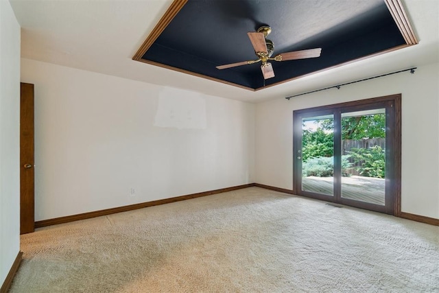 4113 Old Farm Rd, Oklahoma City, OK 73120 - carpeted spare room featuring a tray ceiling and a ceiling fan