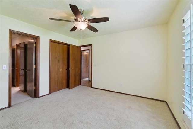 4113 Old Farm Rd, Oklahoma City, OK 73120 - unfurnished bedroom with light carpet, a closet, and ceiling fan
