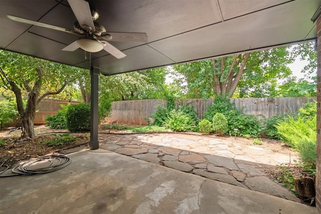 4113 Old Farm Rd, Oklahoma City, OK 73120 - fenced backyard with a ceiling fan and a patio area