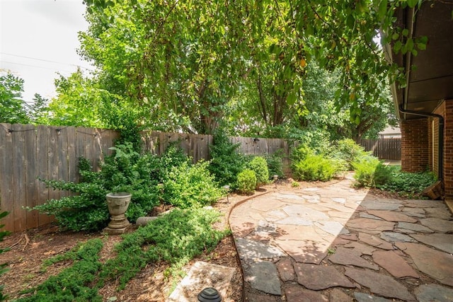 4113 Old Farm Rd, Oklahoma City, OK 73120 - fenced backyard with a patio area