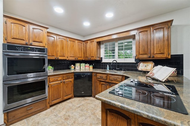 4113 Old Farm Rd, Oklahoma City, OK 73120 - kitchen with black appliances, brown cabinetry, backsplash, recessed lighting, and light tile patterned floors
