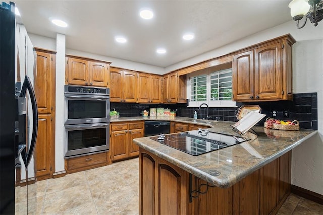 4113 Old Farm Rd, Oklahoma City, OK 73120 - kitchen with black appliances, brown cabinetry, a peninsula, backsplash, and recessed lighting