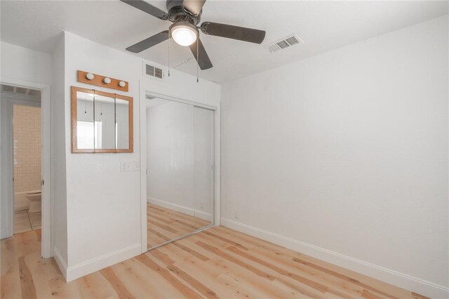 508 S Morrison Ave, El Reno, OK 73036 - unfurnished bedroom with wood finished floors, a closet, baseboards, and ceiling fan