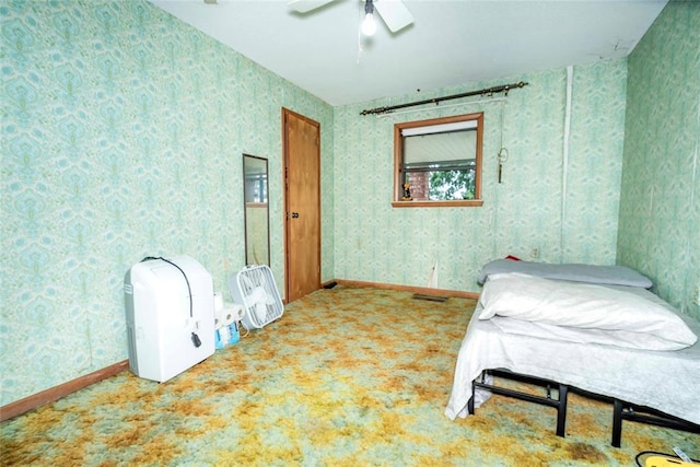 carpeted bedroom with wallpapered walls