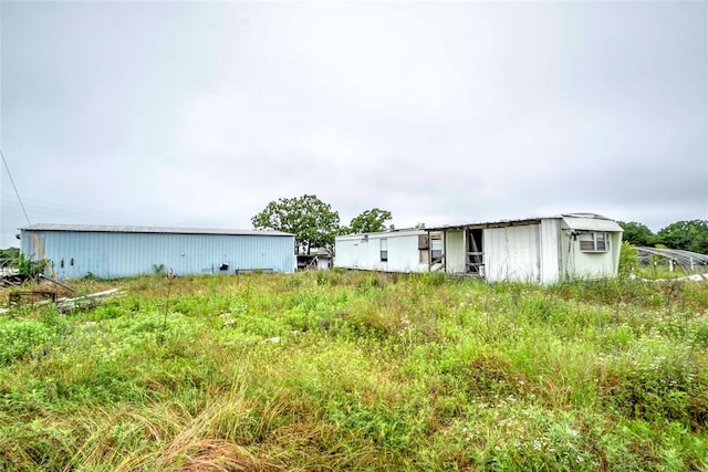 view of yard with an outbuilding and an outdoor structure