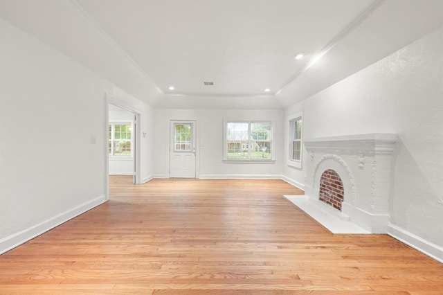 905 NE 21st St, Oklahoma City, OK 73105 - unfurnished living room featuring light wood-style floors, baseboards, a fireplace with flush hearth, and recessed lighting