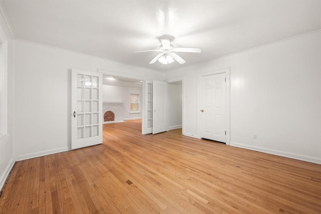 905 NE 21st St, Oklahoma City, OK 73105 - unfurnished bedroom featuring light wood-style floors, baseboards, a ceiling fan, ornamental molding, and french doors