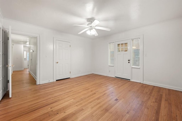 905 NE 21st St, Oklahoma City, OK 73105 - entryway with ceiling fan, light wood-style floors, crown molding, and baseboards