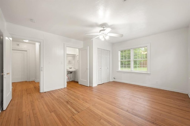 905 NE 21st St, Oklahoma City, OK 73105 - unfurnished bedroom featuring light wood-style floors, baseboards, and ceiling fan