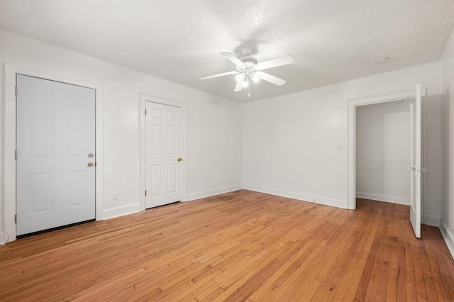 905 NE 21st St, Oklahoma City, OK 73105 - unfurnished bedroom with light wood finished floors, baseboards, and ceiling fan