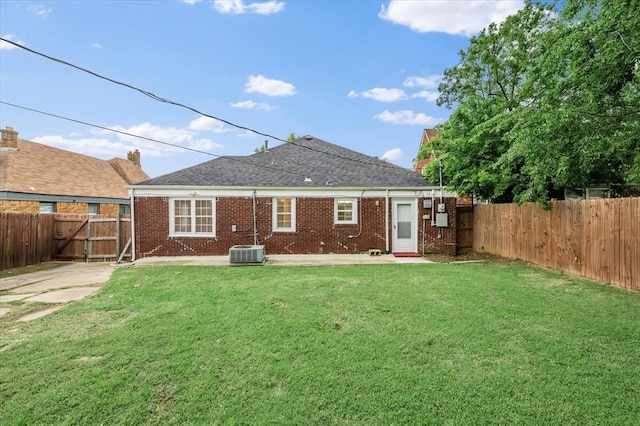 905 NE 21st St, Oklahoma City, OK 73105 - rear view of property featuring brick siding, a patio area, and cooling unit