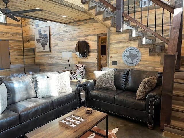 161 Champion Way, Broken Bow, OK 74728 - living room with wooden walls, a ceiling fan, stairway, and lofted ceiling