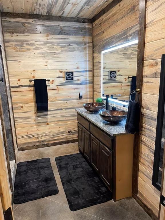 161 Champion Way, Broken Bow, OK 74728 - bathroom featuring wooden walls, wooden ceiling, double vanity, and tile patterned flooring