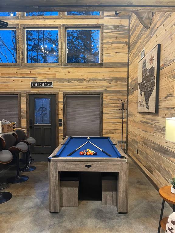 161 Champion Way, Broken Bow, OK 74728 - game room featuring wooden walls, concrete flooring, and pool table
