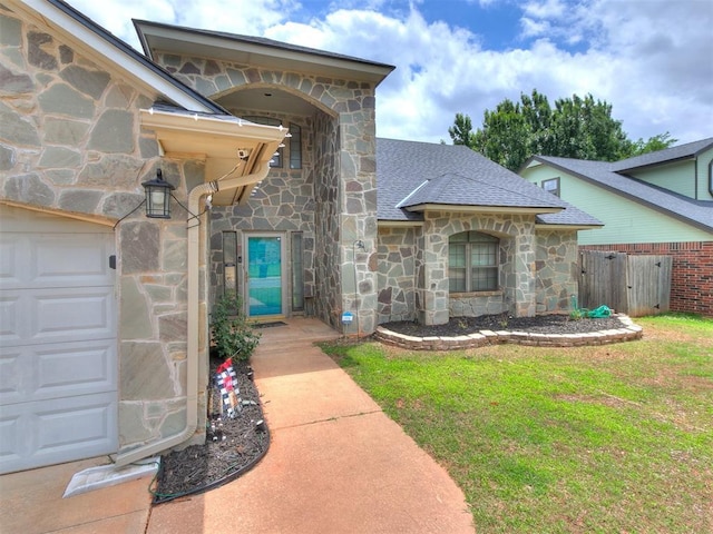 17612 Durbin Park Rd, Edmond, OK 73012 - property entrance with stone siding, roof with shingles, and an attached garage