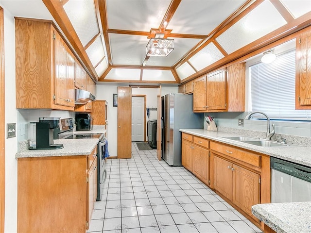 17612 Durbin Park Rd, Edmond, OK 73012 - kitchen featuring a sink, under cabinet range hood, stainless steel appliances, lofted ceiling, and light countertops