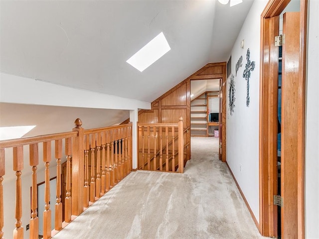 17612 Durbin Park Rd, Edmond, OK 73012 - hall with vaulted ceiling, carpet floors, a skylight, and an upstairs landing