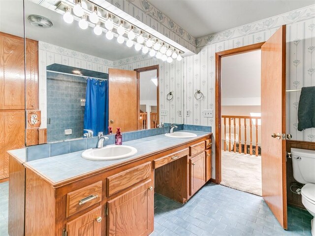 17612 Durbin Park Rd, Edmond, OK 73012 - bathroom with wallpapered walls, toilet, double vanity, tile patterned floors, and a shower with curtain