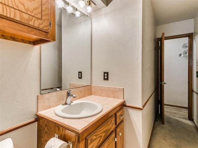 17612 Durbin Park Rd, Edmond, OK 73012 - bathroom featuring vanity and a textured wall