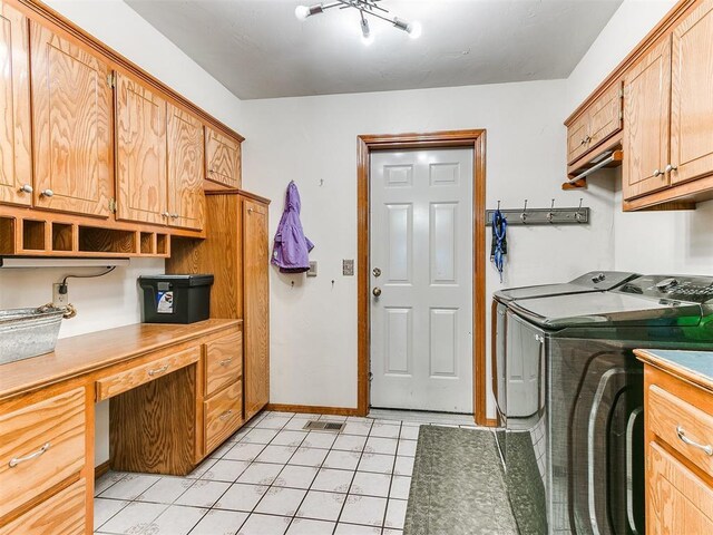 17612 Durbin Park Rd, Edmond, OK 73012 - laundry area with separate washer and dryer, cabinet space, light tile patterned flooring, an office area, and baseboards